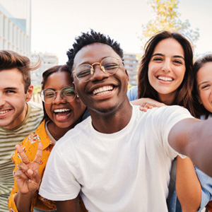 Chicago dental implant patient smiling with friends