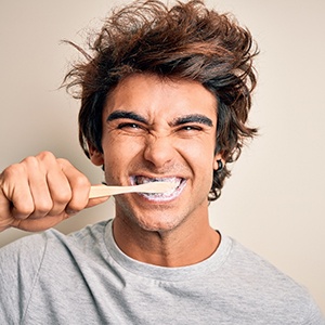 A woman wearing an Invisalign aligner