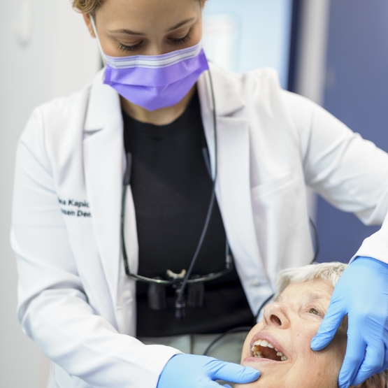 Dentist adjusting a patient's jaw