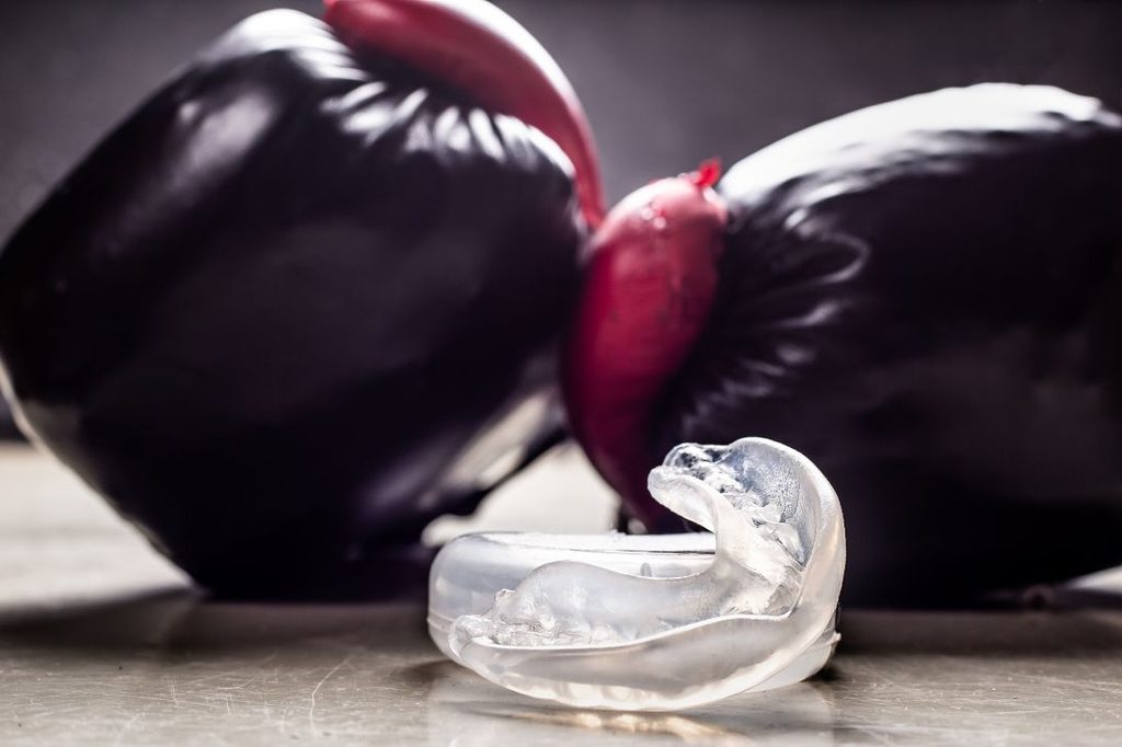 Boxing gloves and a sports mouthguard